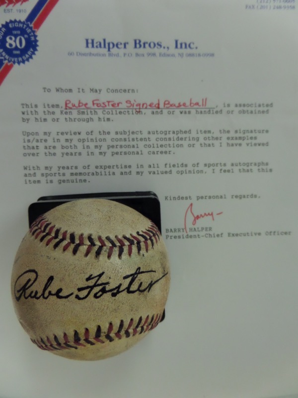 This very old, red and black-laced ball is unlabeled, and comes to us in G+/VG overall condition.  It has been sweet spot-signed in black by Negro League pioneer, pitcher, owner and HOF'er, Rube Foster, the signature grading a legible 7.5, and comes with a full photo LOA from Halper Bros. Inc. for authenticity.  Valued well into the five figures, and a super RARE find!