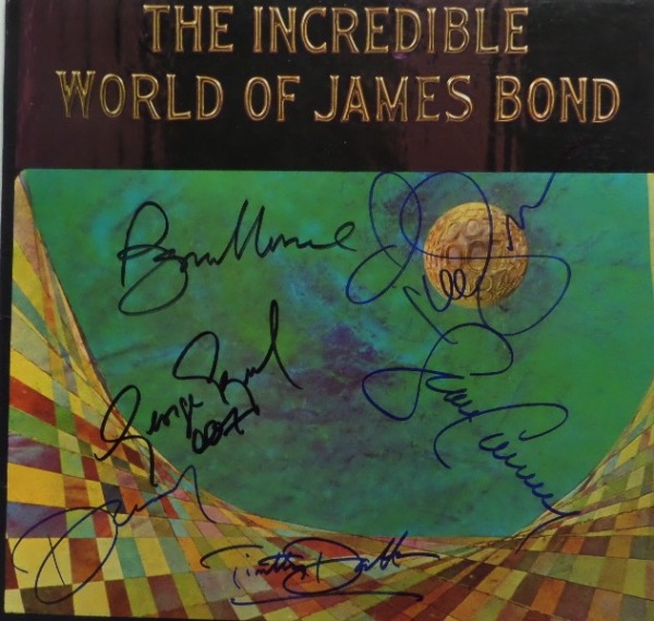 This "The Incredible World of James Bond" original soundtrack LP album is still in EX shape, and comes front cover-signed in blue and black sharpie by 6 men who have portrayed the superspy over the last 60 years.  Included are Sean Connery, Roger Moore, George Lazenby, Timothy Dalton, Pierce Brosnan and Daniel Craig, and with two now deceased, this piece is valued into the low thousands!