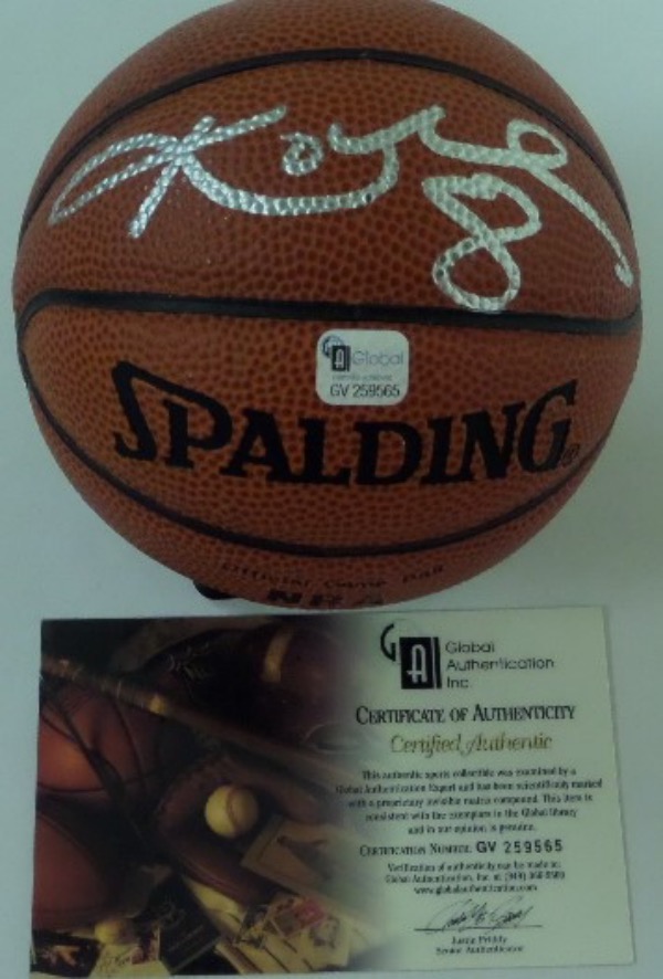 This 5" diameter mini NBA game basketball from Spalding is still in EX/MT shape, and features a silver paint pen signature from all time NBA great, Kobe Bryant.  This is a great-looking signature, spanning almost the entire width of the basketball, and it comes certified by Global Authentication Inc (GV259565) for your assurance.  With Kobe's tragic death now more than 3 years ago, retail is high hundreds, at least!