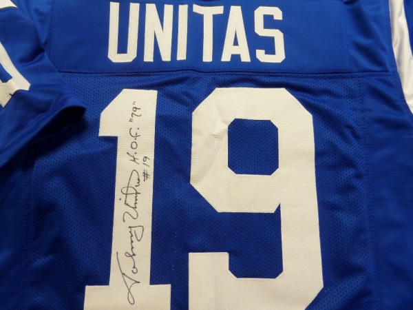 This blue size L Baltimore Colts custom throwback jersey is in NM/MT condition, and comes trimmed in white, with everything hand-stitched.  It is back number-signed in black sharpie by the all time great passer himself, grading a legible 9.5, and including HOF 79 and #19 inscriptions.  With his death now two decades ago, retail on this gorgeous jersey is low thousands!