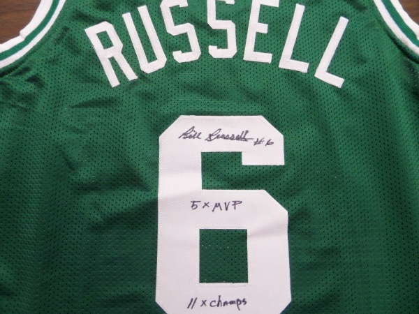 This MUST HAVE NBA item is a green size L custom Boston Celtics #6 Russell jersey, still in NM condition, and trimmed in white, with everything sewn.  It is back number-signed in black sharpie by the greatest center EVER, grading a legible 8, with #6, 5X MVP and 11X Champs inscriptions, and with Russell no longer with us, retail is low thousands on this collector's gem!
