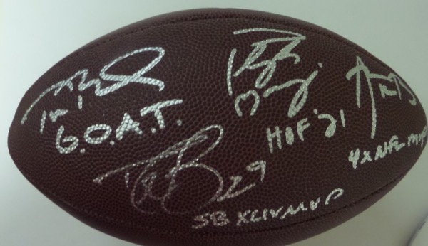 This full size Wilson football is still in NM condition, and comes hand-signed in bright silver by the four greatest QB's of the 21st Century.  Included are Peyton Manning, Aaron Rodgers, Drew Brees and Tom Brady, with each signature grading at least an 8, and each including its own unique inscription--AND these signatures are ALL on the same panel, so just point it in one direction and watch your guests' eyes get huge.  Please check out our attached photo to see this gorgeous football, valued into the low thousands!