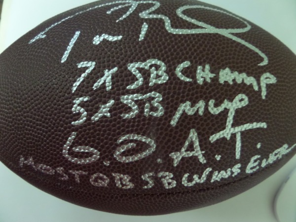 This full size NFL football from Wilson is in NM/MT condition, and comes hand-signed in silver by the greatest of them all, future HOF QB, Tom Brady.  The signature grades an overall 8.5-9, and includes MOST QB SB WINS EVER, G.O.A.T., 5X SB MVP and 7X SB Champ inscriptions, and this football will show off brilliantly in any collection.  Valued into the low thousands!