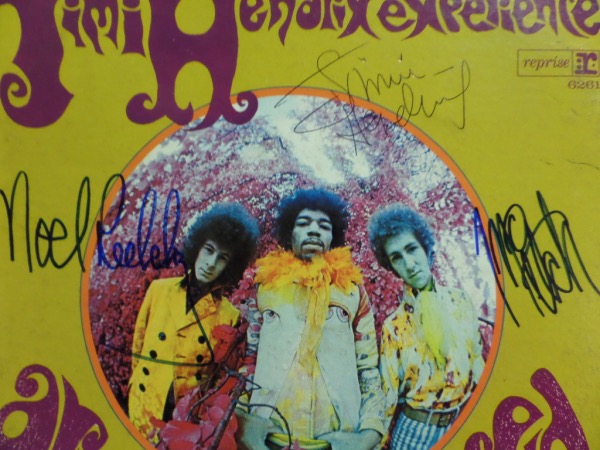This vintage 1967 "Are You Experienced" LP album from The Jimi Hendrix Experience is in EX overall condition, and comes front cover-signed in black ink by the long-deceased guitar great himself, and in blue sharpie by Noel Redding and Mitch Mitchell.  The signatures grade strong, legible 8's overall, and with Hendrix untimely and tragic death over FIFTY years ago, this piece values into the low thousands!!!