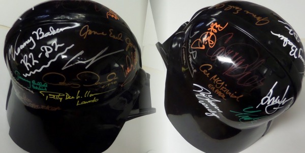This nice-looking Darth Vader helmet is in VG+ condition--there is a slight crack toward the rear--and can slip over your head if you are in the mood to be evil! It is black and comes signed in various vibrant colors by 17 stars from the popular Star Wars movies.  The sig's are 7's-9's overall, and included are Lucas, Williams, Hamill, Bulloch, Mayhew, Oz, Prowse, Williams, Ford, Lawson, Fisher, Daniels, Baker, Jones, McDiarmid, Alec Guinnes and Peter Cushing.  A truly unique and stunningly colorful display item with a retail value WELL into the thousands!