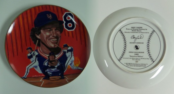 This 10" diameter colorful collector's plate is numbered 70/1000 and from 1985.  It features Robert Stephen Simon artist's images of Gary Carter with the New York Mets, and comes hand-signed in GOLD by the HOF catcher himself.  This is from the Hackett signature edition, so authenticity is no question at all, and retail is mid/high hundreds!