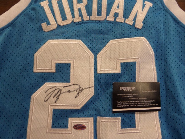 This mint tagged powder blue 1980's style is trimmed in NC white, has sewn on everything as well as name on back, and comes back #23 signed by the best ever in bold black sharpie. It grades a Lee approved 9, shows off well from 20+ feet away, and has the sought after InPerson Authentics lifetime COA and added hologram. Wow!