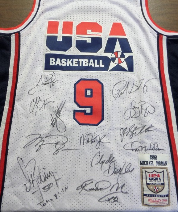 This white size 50 Mitchell & Ness #9 USA Basketball Michael Jordan jersey is in NM/MT condition, with everything sewn, and comes front signed in black sharpie by by all 12 members of the original Dream Team!  Included are Bird, Magic, Jordan, Barkley, Ewing, Drexler, Robinson, Malone, Stockton, Pippen, Laettner and Mullin, and this AWESOME and one of a kind display item books well into the low thousands!