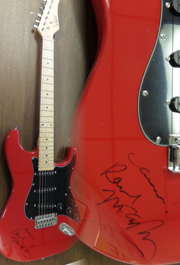 This gorgeous mint electric Glarry guitar comes with the original box, pick ups, bag, straps,etc. and comes signed by the best singer/songwriter of all time in black. SUPERB autograph and shows off wonderfully with "Cheers" included. Guaranteed authentic and get it now because Paul is a tough autograph and not getting any younger! 