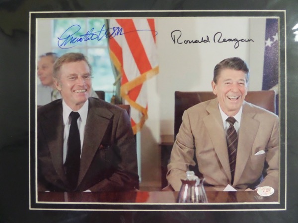 This MINT 12x16 custom matted display features a full color photo of NRA figurehead and Academy Award winning actor Charlton Heston, seated with former Hollywood Star and 40th US President Ronald Reagan.  It is hand-signed by both icons, is ready for framing, and with both stars now deceased, valued well into the hundreds!  Joe DiMaggio Estate LOA included!