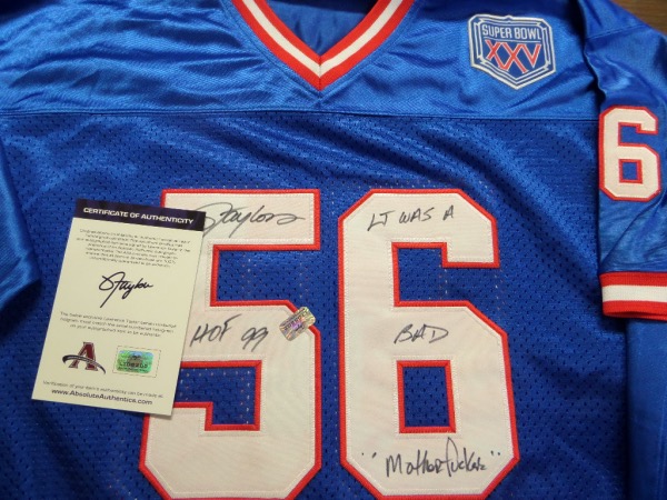 This 1990's styled road blue is a custom jersey, trimmed in NYG white and red colors, and complete with sewn on everything as well as name on back. It comes back #56 signed by "LT" in bold black sharpie, and with a few curse words written about himself. It was signed IN PERSON and comes with a lifetime COA intact. 