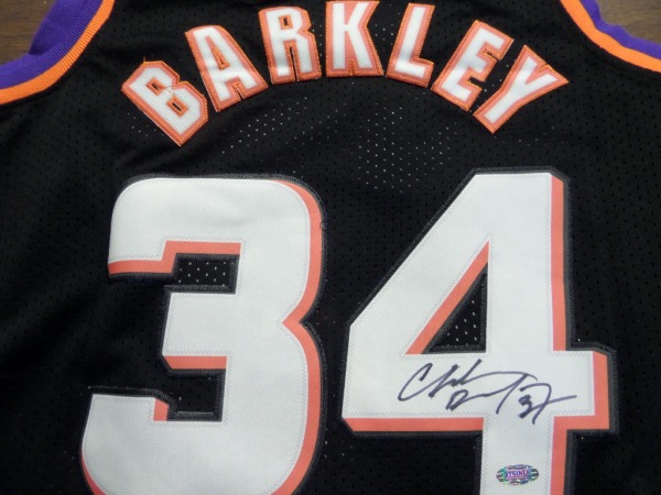 This mint Phoenix road black is trimmed in team orange and purple colors, has sewn on everything as well as name on back, and comes back #34 signed by "Sir Charles". It is a large, bold black marker signature, visible from 40 feet away, and has an original Steiner hologram attached for lifetime certainty. A top 50 all time NBA HOF great, and an easy buy and hold investment to boot.  