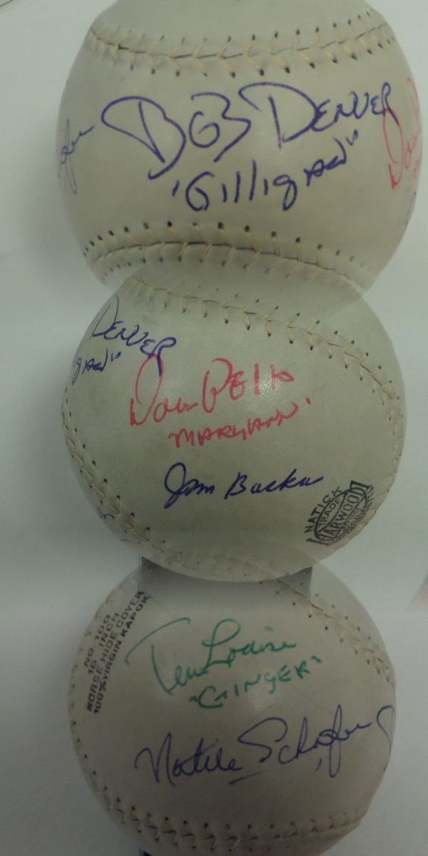 This enormous Harwood Official Softball is white-laced, in EX+ condition, and really very large, measuring 5" in diameter!  It comes hand-signed all over in blue, green, and red inks by all 7 main stars from the hit 1960's show, "Gilligan's Island."  Included are Denver, Hale, Louise, Wells, Schafer, Backus and Johnson, and signature contain character names to boot.  A fabulous Hollywood collector's item, valued into the low thousands!