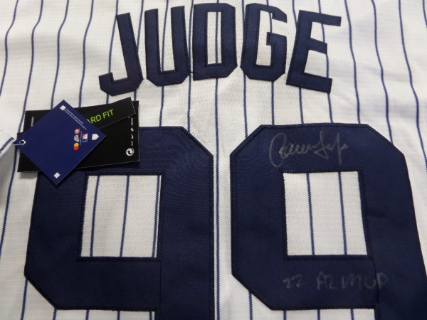 This home white gem is authentic and mint!  It comes signed on the back #99 in silver by this homerun-hitting slugger who ran away with the HR crown last year (and MVP which he has included here!!).  Guaranteed authentic and retail is into the low thousands and rising as the Yanks will reload again this off-season!  Get it now!