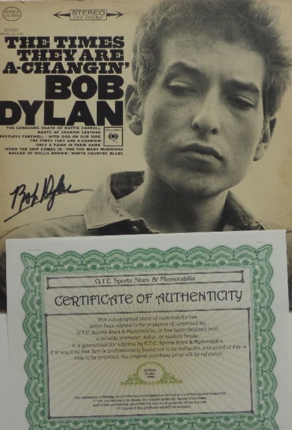 This original 1963 Bob Dylan "The Times They Are A Changin'" LP album is in EX overall condition, and comes front cover-signed in black felt tip marker by the folk/rock music icon himself.  The signature grades about an 8 overall, and the album comes with a COA from GTE Sports Stars & Memorabilia for authenticity purposes.  Valued well into the hundreds!