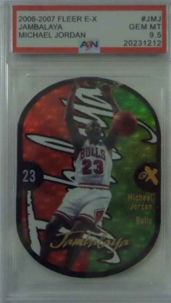 This card books in the 6 figures in this condition and shows MJ dunking with mouth open!  Comes slabbed and graded by AZN as Gem MT 9.5!  Card looks amazing in the slab with great coloring!  WOW!