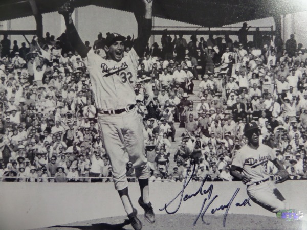 This B&W 8x0 is circa 1965, shows Sandy on the mound after a big win, and has the original Steiner COA and lifetime hologram affixed. It comes boldly black sharpie signed, grades a clean honest 9all over, and shows off well from 16 feet away. Great buy, and sold here with NO reserve! 