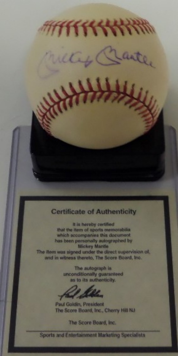 This official NL(Giamatti) baseball is in NM shape and comes sweet spot signed by the Mick in blue ink!  Shows off superbly and comes with the original 1990's Scoreboard COA for authenticity purposes!  Retails in the super high hundreds and nice!