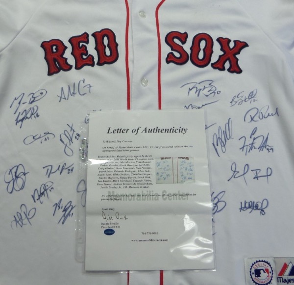 This home white size L Boston Red Sox jersey from Majestic is in EX/MT shape, and comes front-signed in black sharpie by no less than 26 members of the 2018 World Series Champion Boston Red Sox!  Included are all the stars, with Betts, Bradley, Ramirez, Bogaertz, Benintendi, Price, Sale, Pearce, and many more, and retail on this gem is low thousands+++!  A full photo LOA from The Joe DiMaggio Estates is included for certainty!