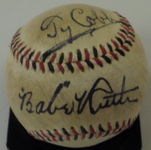 This vintage red and black-laced baseball is cubed in VG overall condition with light toning and aging evident.  It is hand-signed on the top panel in by Ty Cobb and on the sweet spot by Babe Ruth, both in black fountain pen ink.  Both signatures are super bold and legible, having been well-preserved throughout the years, and with both 1936 HOF Inductees and all time greats present on this gorgeous ball, retail is into the five figure range!!!!
