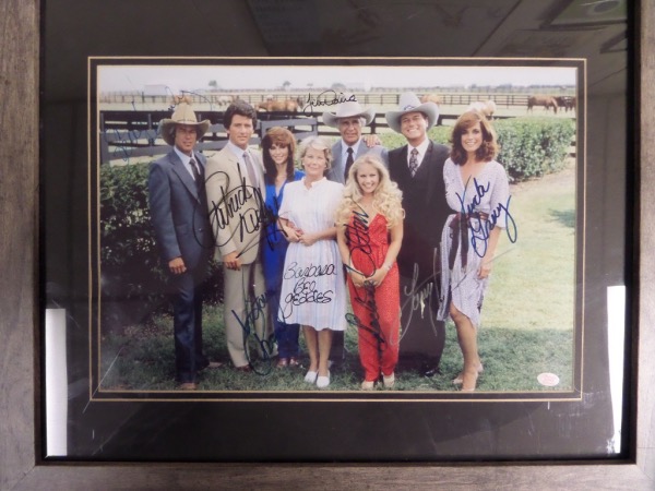 This "South Fork" must have shows 8 main cast members, comes sharpie signed by everyone, and grades a 10 all over the place. Add in the double mat, the professional wood framing, and the Showcase Authentics lifetime COA plus added hologram, and you have an easy 1980's TV decision to make. Of course "JR, Sue Ann, Bobby, Jock, Lucy, Pam" and the rest are here, and value has to be $1200.0 or more. 
