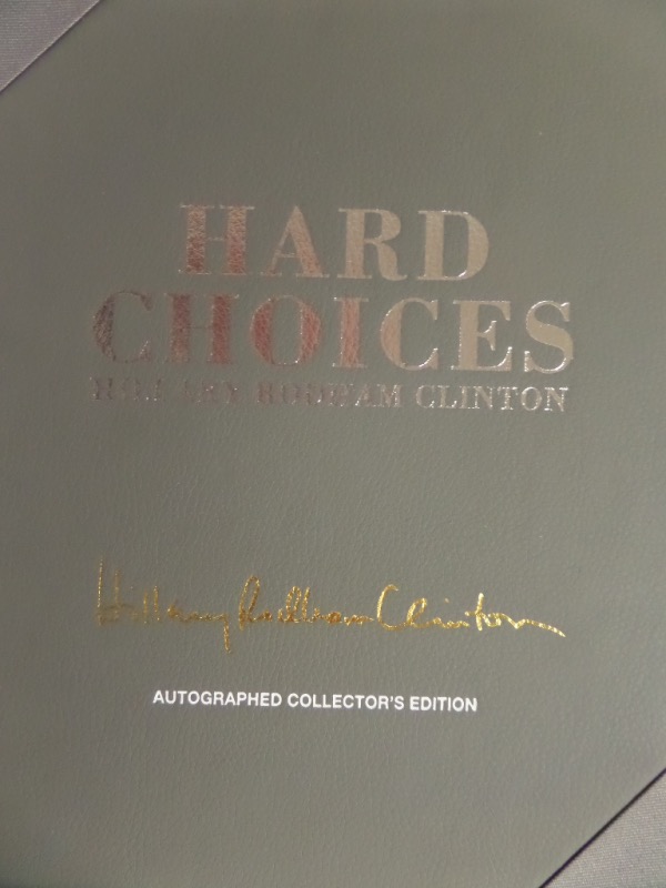 This superb item is encased for show off, is her hand signed hardback book "Hard Choices" and comes in the real leather Premiere Collectibles packaging. This is not a $50.00 item, rather a $495.00 display piece, suitable for any coffee table, and sold here with NO reserve! 