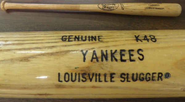 This gorgeous collector's item is a 33.5" Genuine K48 model Lousville Slugger wooden bat, with YANKEES engraved on the barrel.  It is in EX overall condition, but still shows nice usage, and was a team issued bat that was used in Spring Training with the Yanks, somewhere in the 1986-89 era.  A MUST HAVE NYY collector's item, valued well into the hundreds!