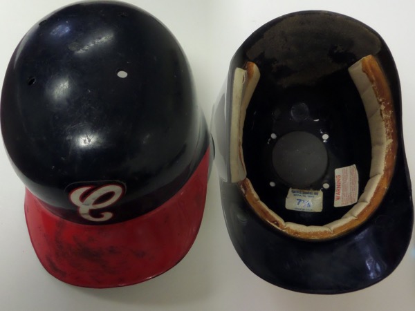 This size 7 1/4 Chicago White Sox batting helmet is in the late '80's to early '90's style, in navy blue, with a red brim, and the Chicago "C" in red and white.  This one shows a ton of usage, even pine tar smudges and scuffing, and though it has aged over time, is still in EX overall condition, and is an absolute MUST for the White Sox collector!