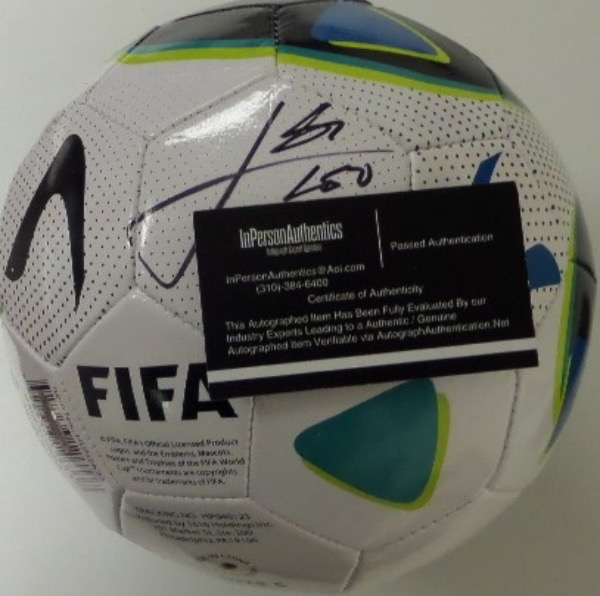 This mint leather soccer ball is from FIFA and comes boldly black marker signed by the International soccer star. It grades a clean bold 10 all over, has the sought after InPerson Authentics lifetime COA intact, and value is ? 