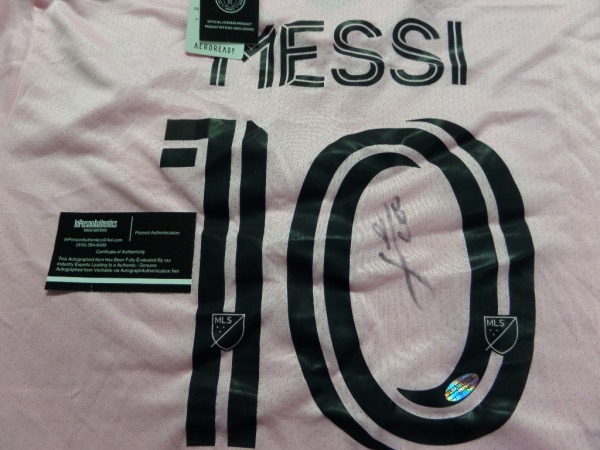 This stunner is a well designed, pink Adidas jersey, and comes with name on back. It is boldly black sharpie signed by the International star and future HOF'er, grade is an honest 8-9, and and it even has the InPerson Authentics COA and added hologram for lifetime certainty.