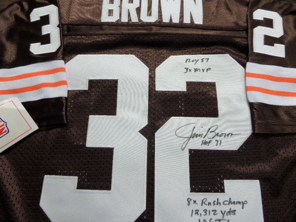 This brown size 50 custom 1964 throwback Cleveland Browns #32 Jim Brown jersey from Mitchell & Ness is tagged as NEW, and comes with everything custom hand-sewn.  It is back number-signed in black sharpie by the greatest running back EVER, including 3X MVP, HOF71, ROY 57, 8X Rushing Champ, 12,312 yds, and 106 Rushing TDs inscriptions!  Now THAT'S a rarity from the all time great, now deceased, and the retail value of this jersey is high hundreds, and might even touch low thousands!