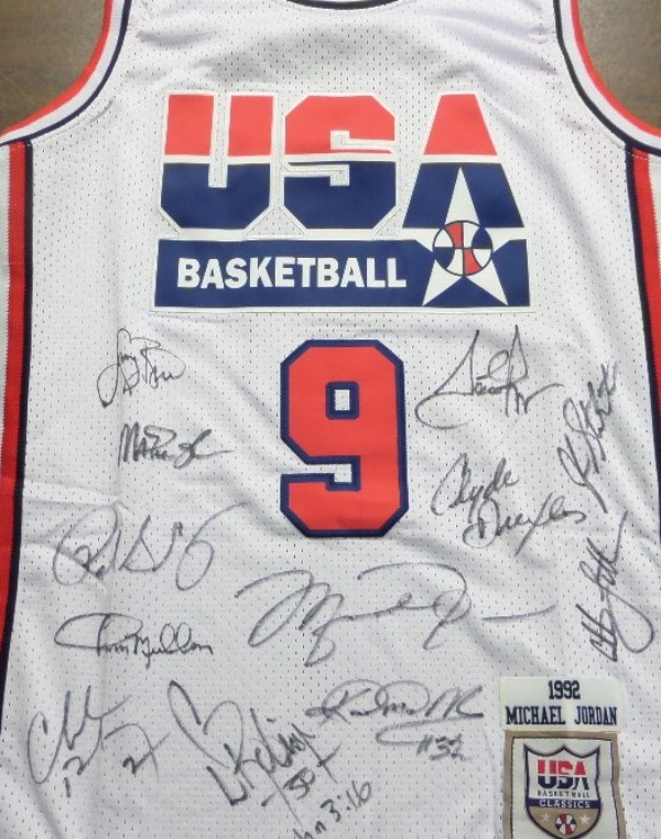This white size L Mitchell & Ness #9 USA Basketball Michael Jordan jersey is in NM/MT condition, with everything sewn, and comes front signed in black sharpie by by all 12 members of the original Dream Team!  Included are Bird, Magic, Jordan, Barkley, Ewing, Drexler, Robinson, Malone, Stockton, Pippen, Laettner and Mullin, and this AWESOME and one of a kind display item books well into the low thousands!