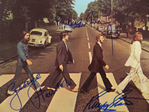 This original 1969 "Abbey Road" LP album cover from THE BEATLES is in VG+/EX overall condition, and comes front cover signed by Paul McCartney, Ringo Starr and George Harrison, and the long-deceased musical icon and Beatles singer/songwriter, John Lennon.  These are strong signatures, grading legible 8's at least, and this piece is an absolute MUST OWN for Beatles faithful!  Valued into the low thousands!