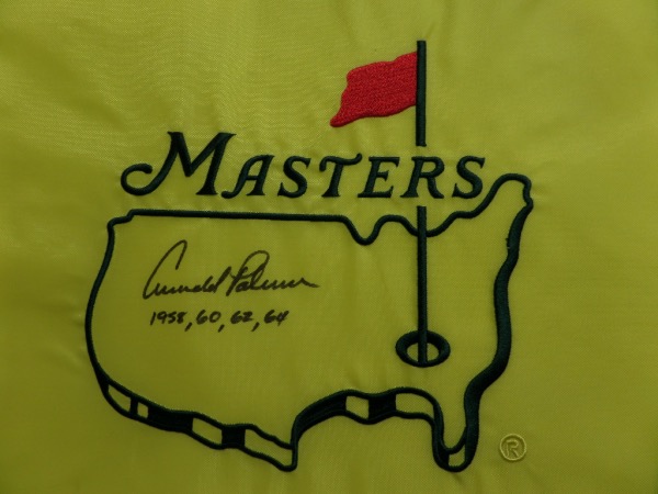This MINT yellow Masters logo pin flag comes hand-signed in black sharpie by all time PGA great, Arnold Palmer.  The signature grades a legible 8, including the 4 years that he won the major event, and this baby will frame and display proudly in any golf collection.  With Palmer no longer living, retail is high hundreds!
