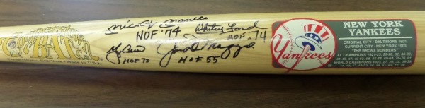This NY Yankees commemorative baseball bat from the reputable Cooperstown Bat Company is still in NM shape, with team logo and championship info listed.  It comes hand-signed in black sharpie by four of the team's all time greats, including Mickey Mantle, Whitey Ford, Yogi Berra and Joe DiMaggio, each signature grading a 9 or better and including a HOF inscription!  With all four men no longer with us, this bat is valued WELL into the thousands!