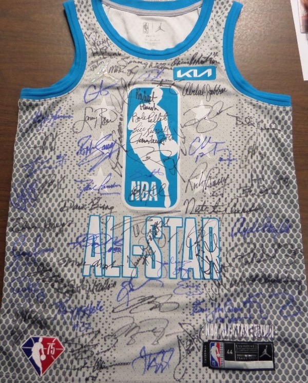 This gray, aqua and white "All Star" size 44 jersey is still in EX/MT shape, and comes front-signed in blue and black colored sharpies by 62 of the 75 members of the recently-selected 75th Anniversary NBA team.  Included are all 62 living members at the time of the selection, including Magic, Bird, Pettit, Russell, Wilkins, Robertson, D. Robinson, Cousy, West, Pierce, Parish, Barry, Bing, Worthy, Gervin, Archibald, Jordan, Pippen, McHale, Olajuwon, Drexler, Frazier, O'Neal, Dr J, Walton, Hayes, Malone, James, Baylor and many more.  Some have died since this signing, making it all the more valuable, and you will not find a jersey with as many reps on it!!!