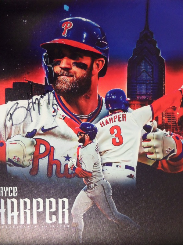 This full color lihto print is done on an 18x22 canvas, and is a collage of images of Phillies' superstar and future HOF'er, Bryce Harper.  It is hand-signed in black by the 2021 NL MVP himself, will frame gorgeously, and retail is high hundreds all day long.  This would make one heck of a gift for the Phillies Phan in your life!