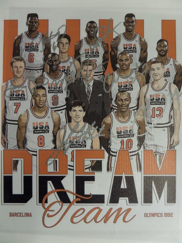 This full color Dream Team litho print is done on a framable 18x22 canvas, and comes hand-signed in silver by 7 of the 12 team members.  Included are Michael Jordan, Larry Bird, Magic Johnson, David Robinson, John Stockton, Chris Mullin and Charles Barkley.  AWESOME Dream Team item, and with 7 sigs, retail is high hundreds!