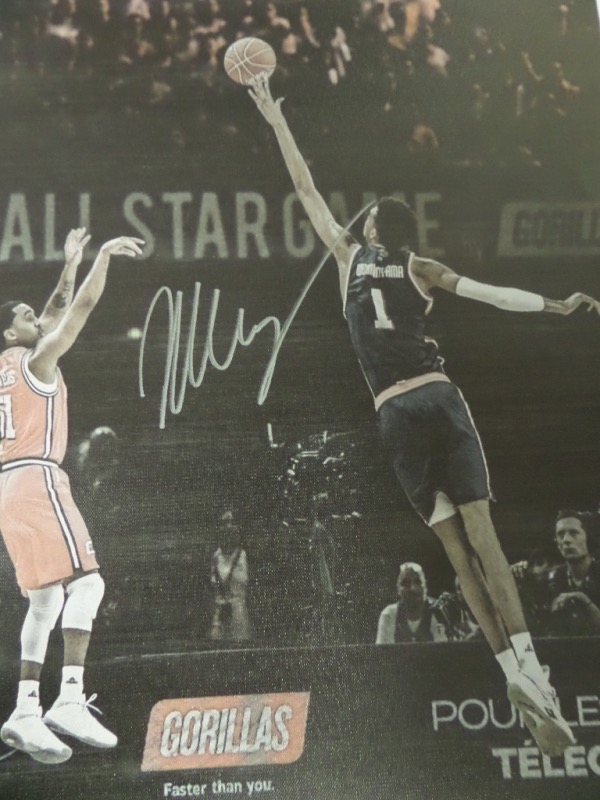 This full color image is done on a real 18x22 canvas, and is an image of #1 NBA pick Victor Wembanyama blocking a shot from what looks like a different time zone!  It is hand-signed in silver by the league's newest superstar, is ready to frame and display, and retail is mid hundreds!