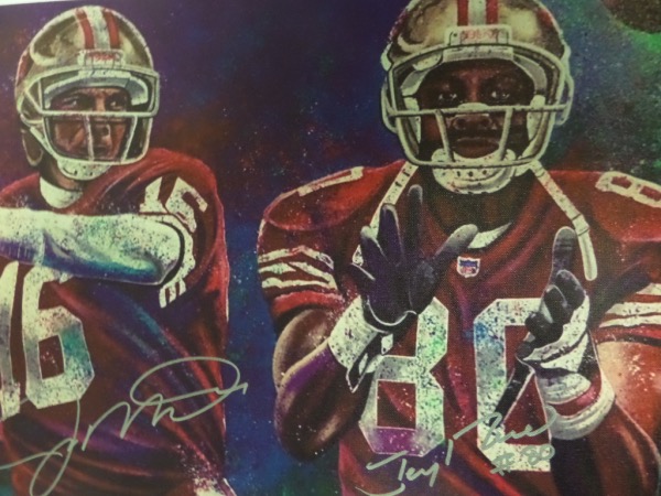This full color artist's litho print is done on an actual 18x22 canvas, and is an image of 49'ers HOF duo, Joe Montana and Jerry Rice.  It is hand-signed in silver by both HOF greats, is a perfect size for framing and showing off, and retail is mid/high hundreds on this jewel!