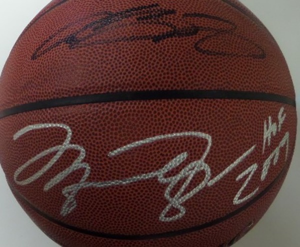 This All Surface full size basketball from Spalding is still boxed in NM condition, and comes hand-signed by two of the five greatest players in NBA history.  Included are Michael Jordan in silver and LeBron James in black, and signatures are on adjacent panels for optimum "displayability!"  Valued into the low thousands!