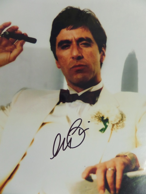 This full color 11x14 photo shows revered actor Al Pacino dressed in a white tux as his Tony Montana character in 1982's "Scarface."  It is hand-signed in black sharpie by the Academy Award winning living legend himself, grading a clean 9 at least, and this photo will make for a super cool addition to any Hollywood collection!