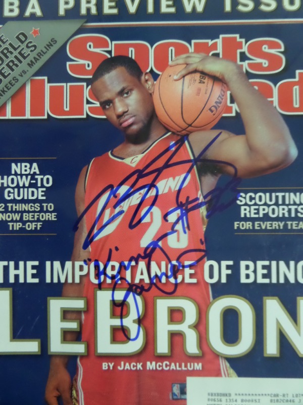 This October 27, 2003 issue of Sports Illustrated is the NBA Preview issue, and features a guy who, at the time, still hadn't even played a game yet.  Of course, he has now, and now, he's the NBA's All Time Scoring Leader, so the magazine is worth a bit now.  It comes hand-signed in blue sharpie by LeBron, grading a 9, with King James added as an inscription.  Awesome collector's item, valued into the very high hundreds!