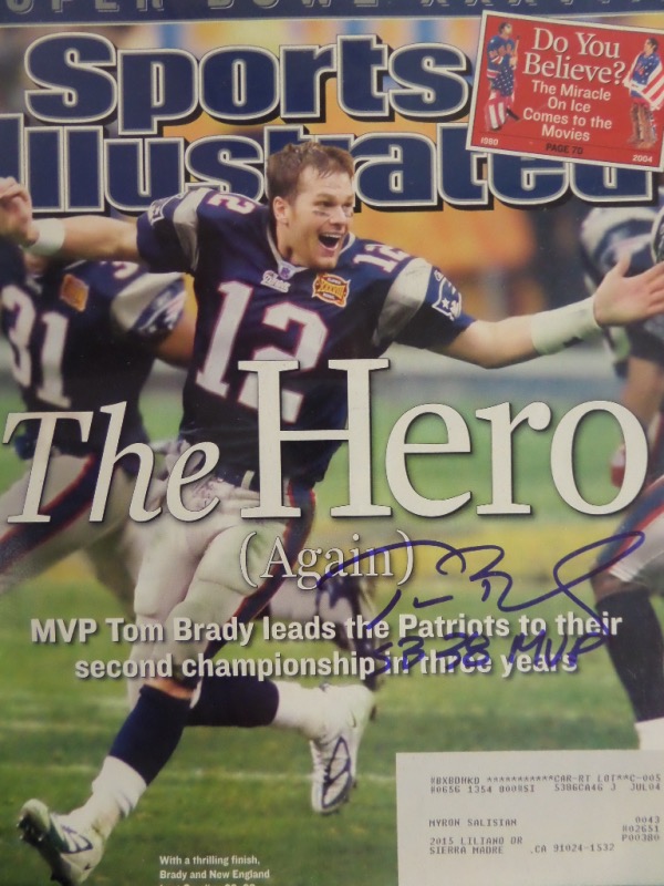 This 2/9/04 full issue of Sports Illustrated is in EX/MT shape, with a color image of Tom Brady celebrating his 2nd Super Bowl on the front cover.  It is hand-signed in blue sharpie by the man himself, grading a 9 at least, with a SB 38 MVP inscription.  Valued into the high hundreds!