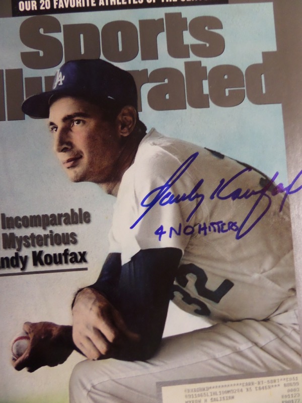 This July 12, 1999 full issue of Sports Illustrated is in EX/EX+ condition, with a color image of Dodgers all time great Sandy Koufax on the front cover.  It is hand-signed in blue sharpie by the man himself, grading a strong 8.5-9, with a 4 No Hitters inscription, and retail is mid/high hundreds!