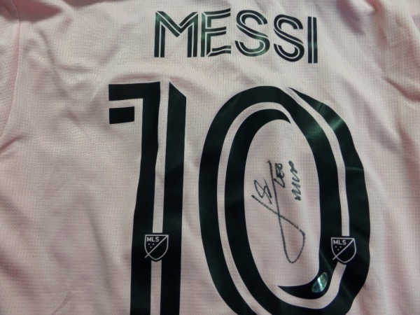 This gorgeous and mint pink Miami jersey comes signed by this legend with LEO and MVP included. It comes hologrammed by InPersonAuthentics for authenticity and is a must for the Messi fan! Retails into the low thousands. 