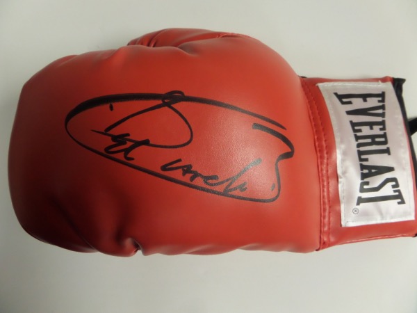 This MINT red Everlast lace up boxing glove is still tagged as new, and comes hand-signed by one of the finest Middleweights in recent memory.  Canelo Alvarez has signed in black sharpie, grading a large, overall 9 or better.  First time offering here at CCSA, and retail is well into the hundreds!