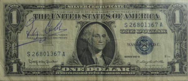 This vintage Series 1957 B United States Silver Certificate $1.00 bill is still in VG shape overall, and comes hand signed in blue by lifetime .367 hitter and 1936 original HOF Inductee, Ty Cobb.  The signature grades about a 6.5, but will still be seen from 7-10 feet away, and with Cobb's death now more than 60 years ago, retail is low thousands!