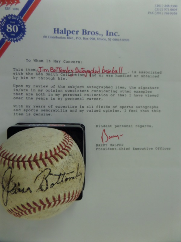 This vintage red-laced baseball is in G/G+ shape, and comes hand-signed in black fountain pen ink by HOF Cardinals 1st baseman, Jim Bottomley!  The signature wears evenly with the ball, grading about a 5, and the ball, Halper Bros., Inc. certified, is valued well into the low thousands!