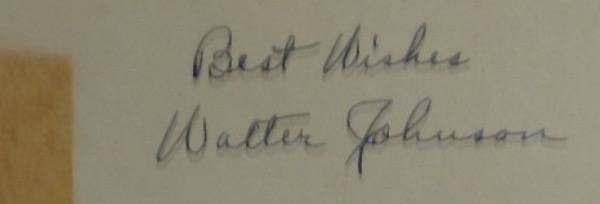 This roughly 3.25x5.5" thick stock card has a silver backing and a mark of adhesive on the left side.  It is hand-signed against the white front part in black ink by 400 game winner and 1936 HOF Inductee, Walter Johnson, complete with a Best Wishes inscription, and grades a legible 6.5.  Ideal for framing and display, a GORGEOUS signature, and valued well into the low thousands!